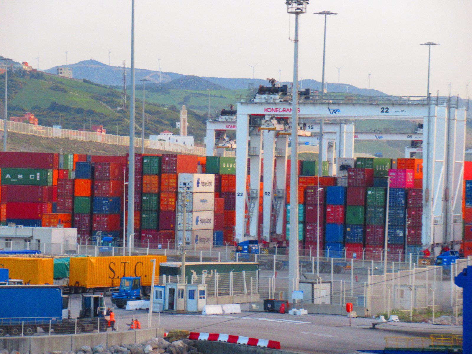 Several containers stacked near a port