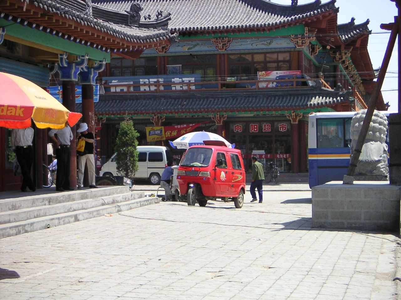 Alley corner in China, three-wheeled Bajaj taxi, Asia free photo