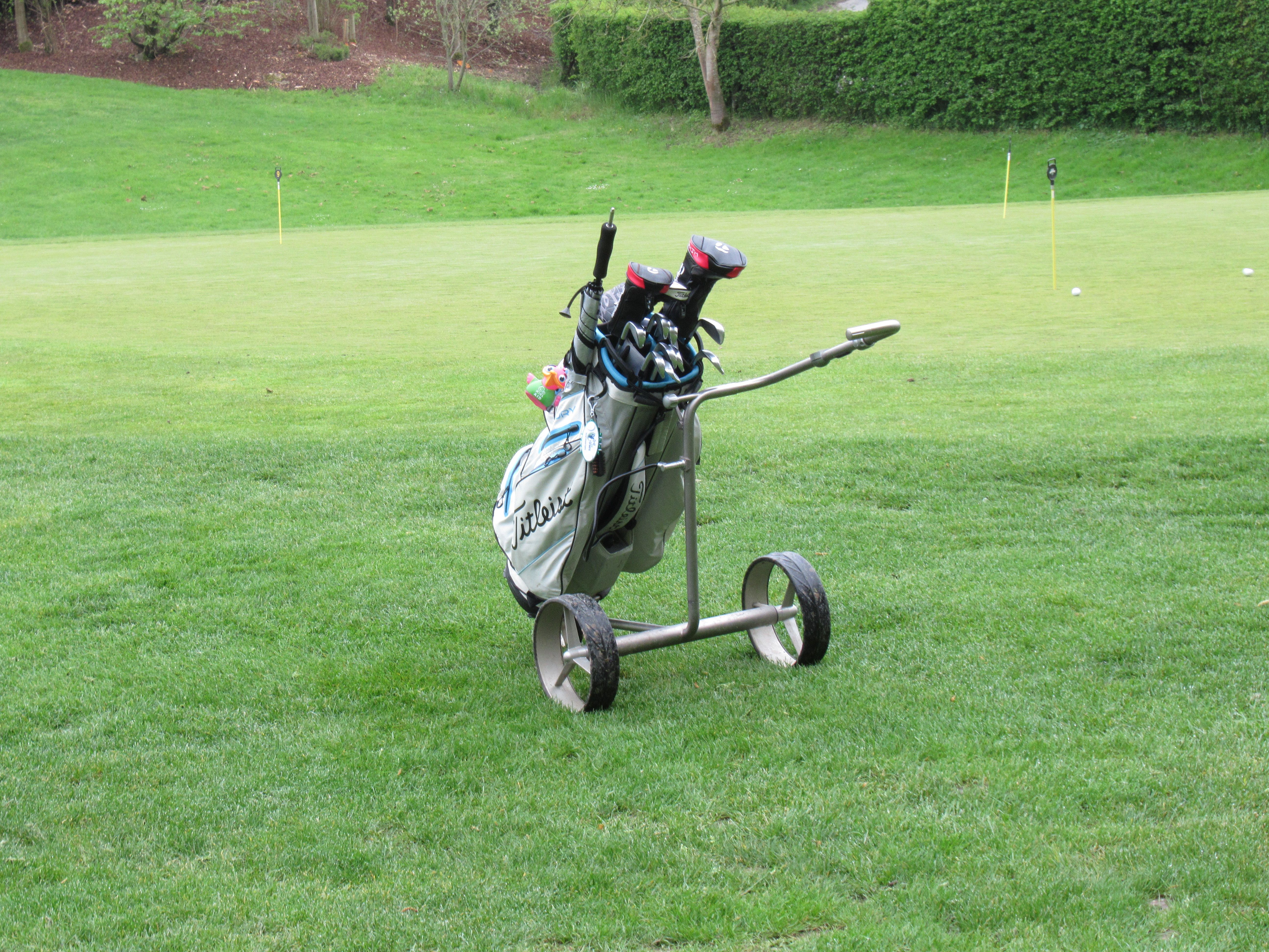 Golf caddy on the green