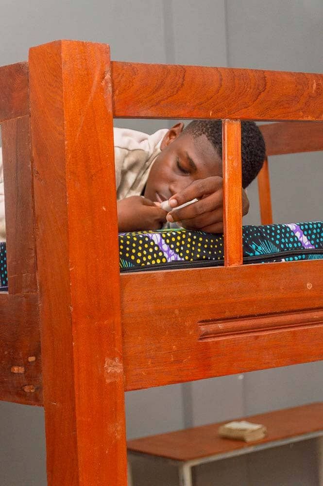 Boy sleeping on bed free photo