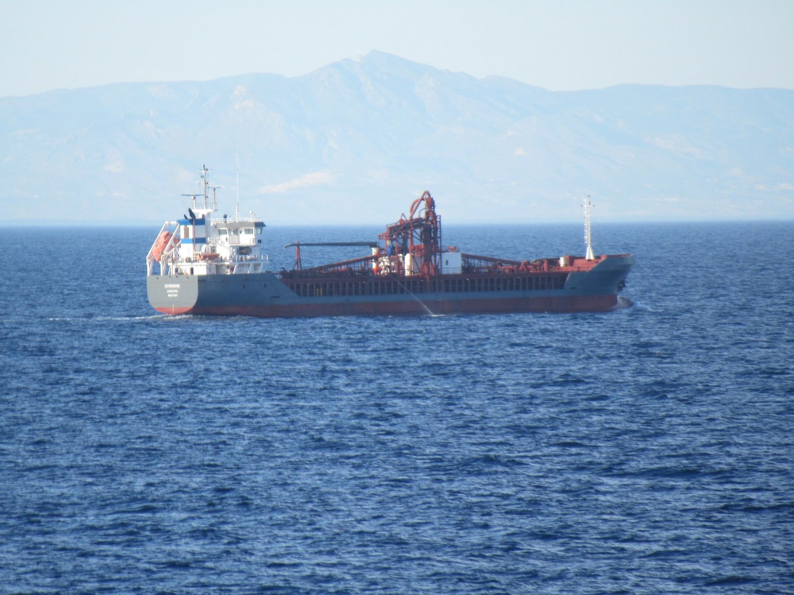 CEMBROOK, Cargo ship sailing on the ocean free photo
