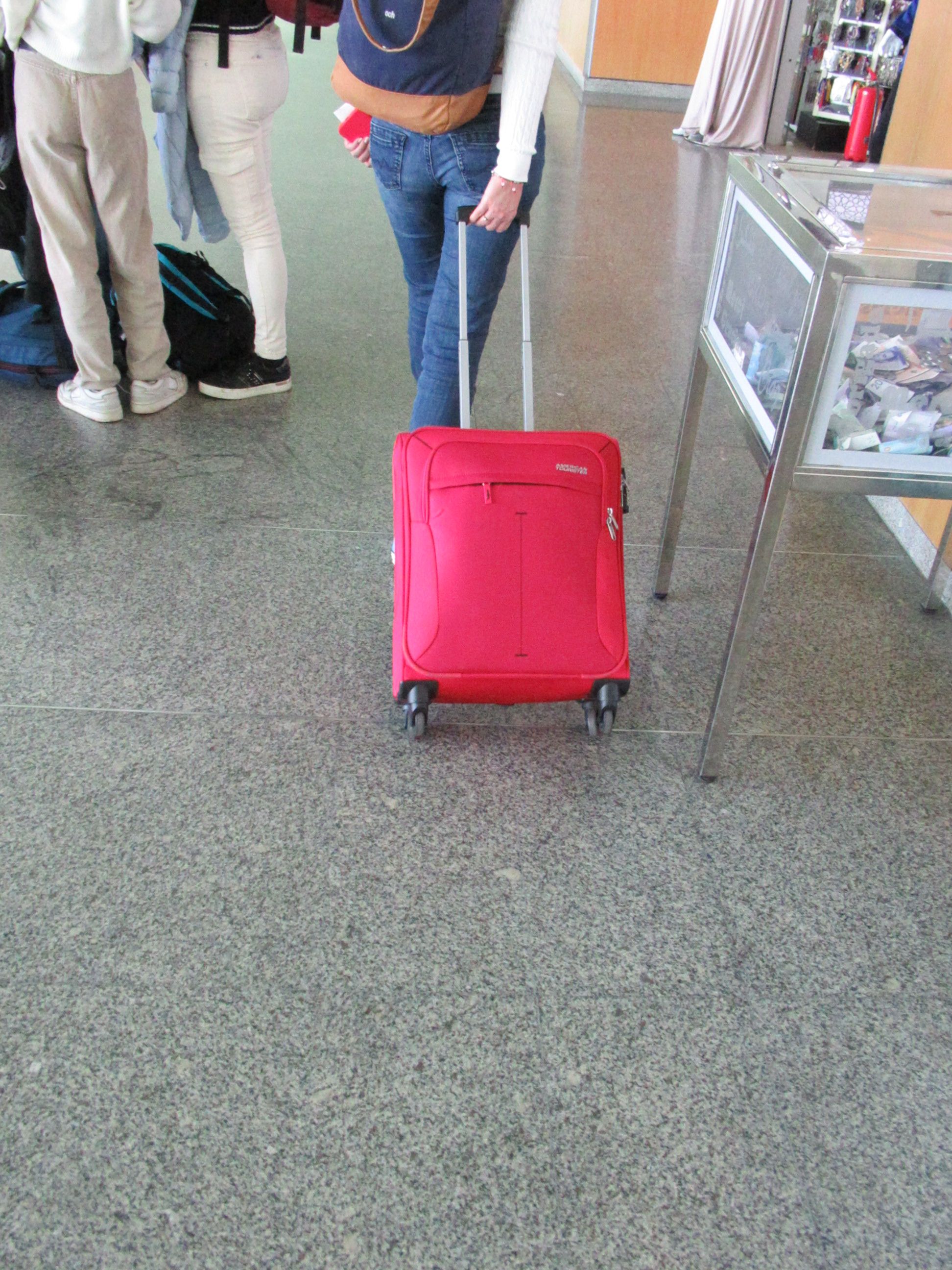 American Tourister model red suitcase
