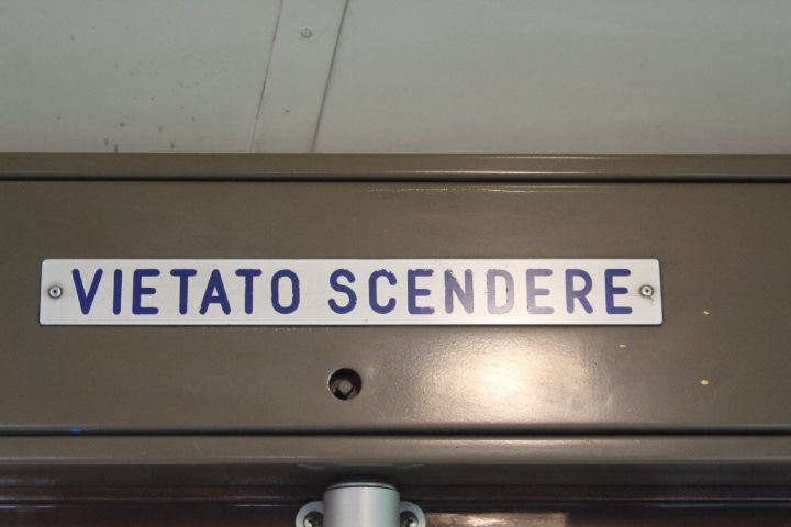 VIETATO SCENDERE, is an Italian phrase meaning "No getting off" or "Forbidden to get off", a description found in the tram, free photo