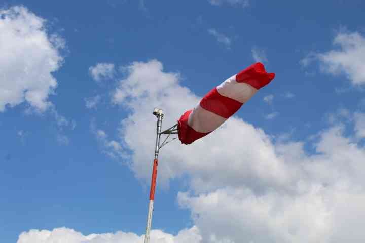 Windsock attached to the end of a pole, free photo