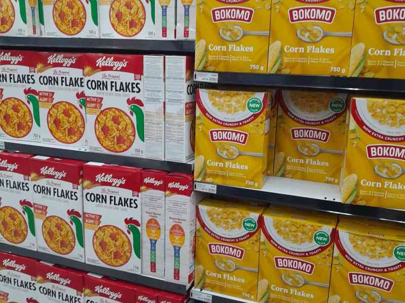 Corn Flakes cereal aisle in a supermarket free photo