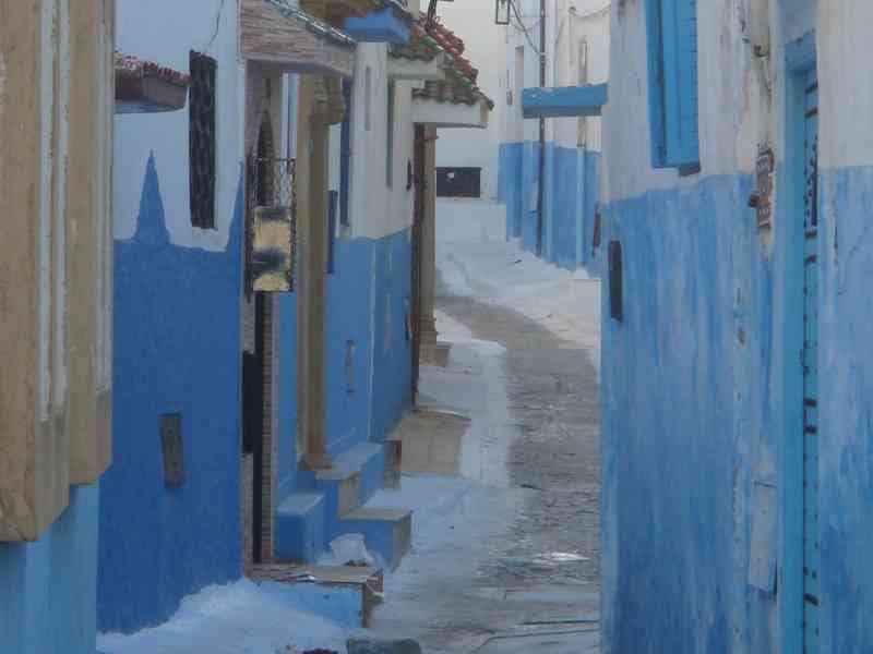 Andalusian architecture of a white-blue street in the Kasbah of the Oudayas free photo