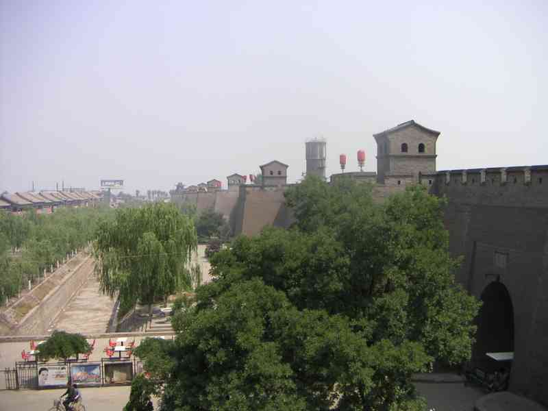 Walls of an ancient fortress city of Pingyao, weeping willow plant, China, Asia free photo