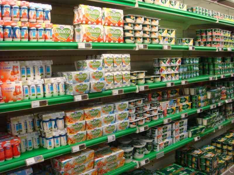 Different brands of dairy products on the shelves at the Casino supermarket