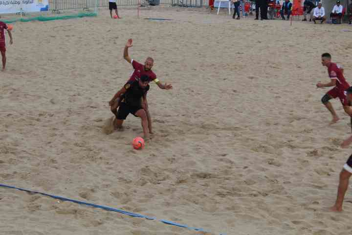 A football duel between two opposing players for possession of the ball free photo