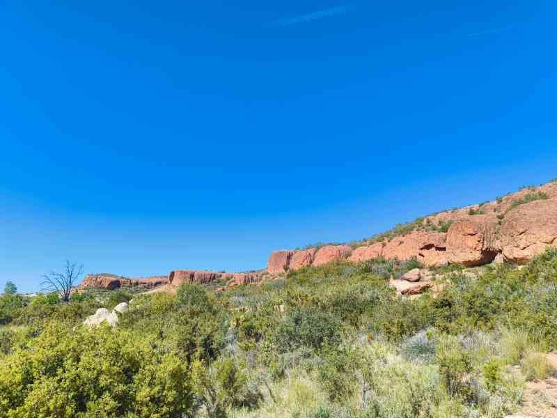 A vegetative landscape with rock formations, free photo