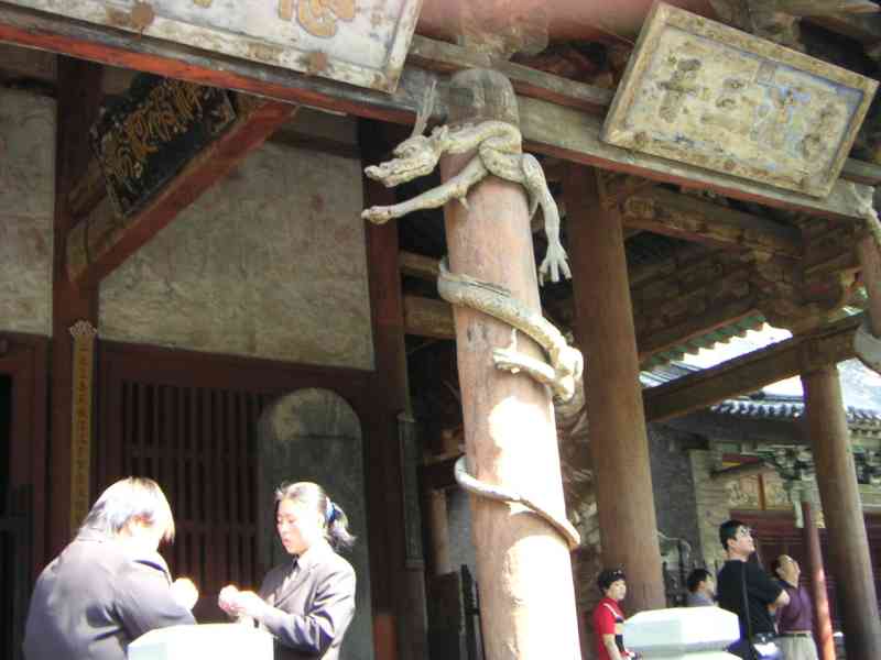 Dragon sculpture around a pole at Jinci Temple in China, Asia free photo