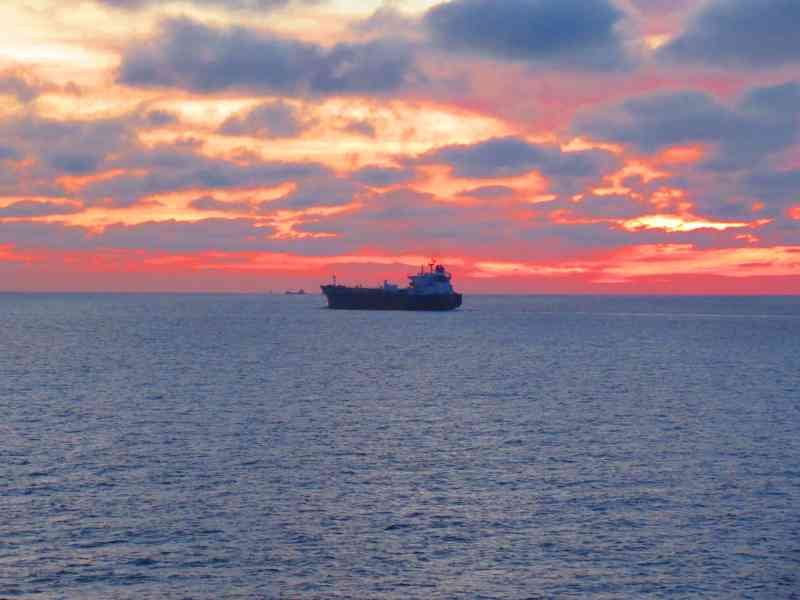 Ship on the horizon, sunset on the sea free photo