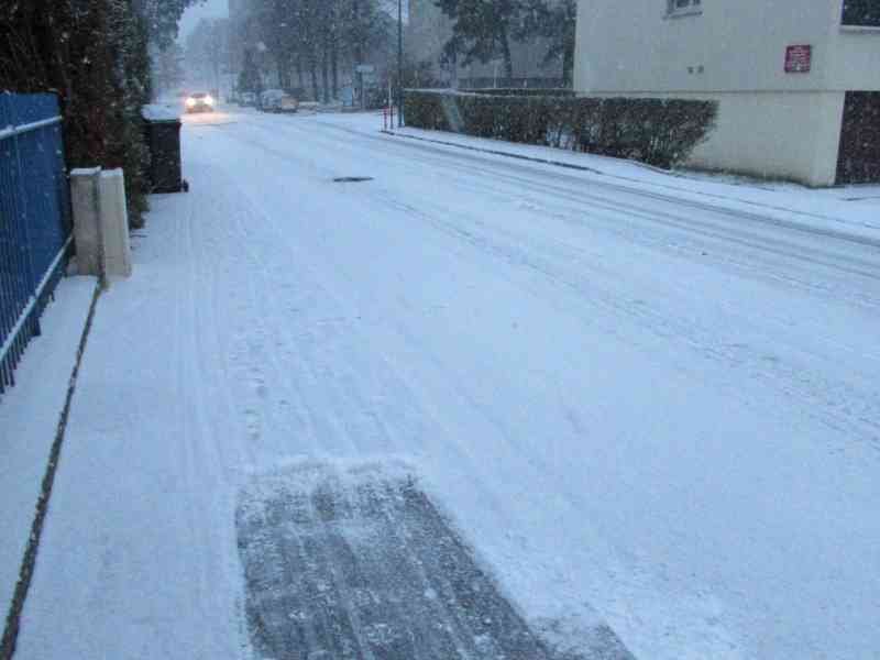 Snowfall covering a street