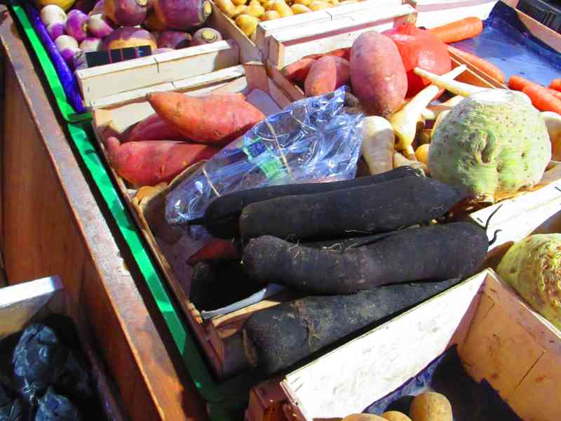 Root vegetable stall at the market free photo